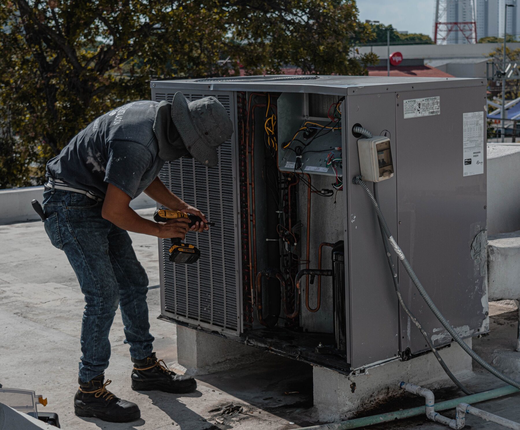 Samson technicians inspecting an outdoor AC/HVAC unit